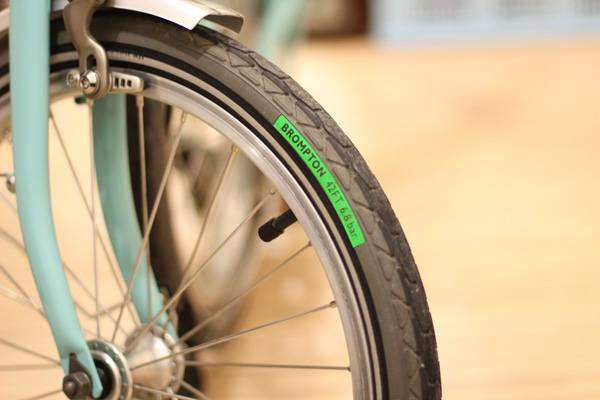 Standard tires that comes with Kevlar belts to resist punctures and good treads to grip slippery road surface.