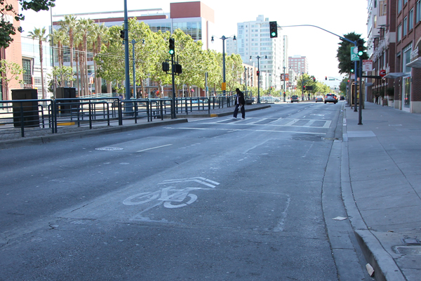 Bike sharrow is placed in the middle and the original sharrow near the gutter is gone.