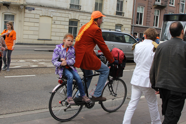 Here is this girl and her father dressed for Queen's Day.