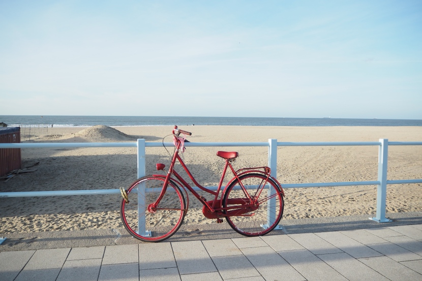 A beautiful red bike at Scheveningen beach.