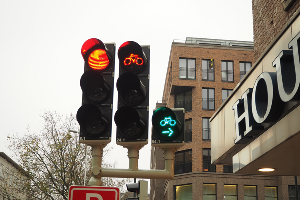 Traffic lights for cyclists at a junction in Utrecht. Cars are not allowed to turn right on red.