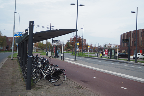A bus stop with bike racks in Eindhoven.